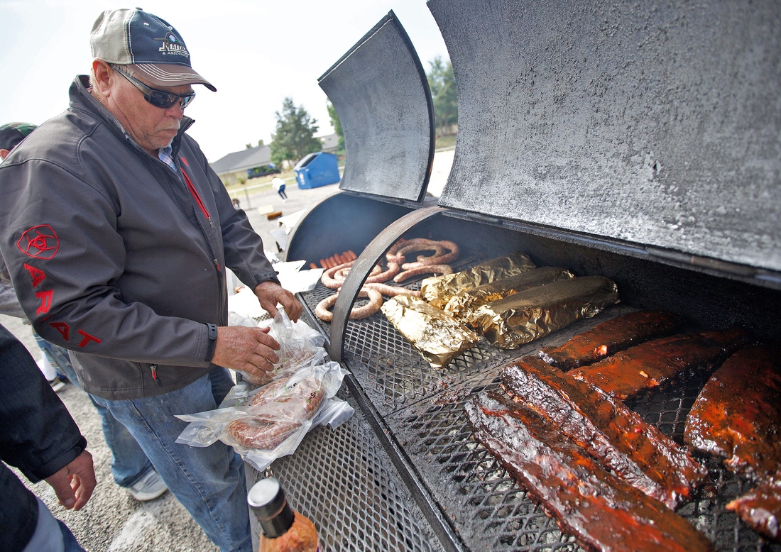 Clayton Weishuhn grills food before the Angelo State University homecoming game Saturday, Oct. 12, 2019.