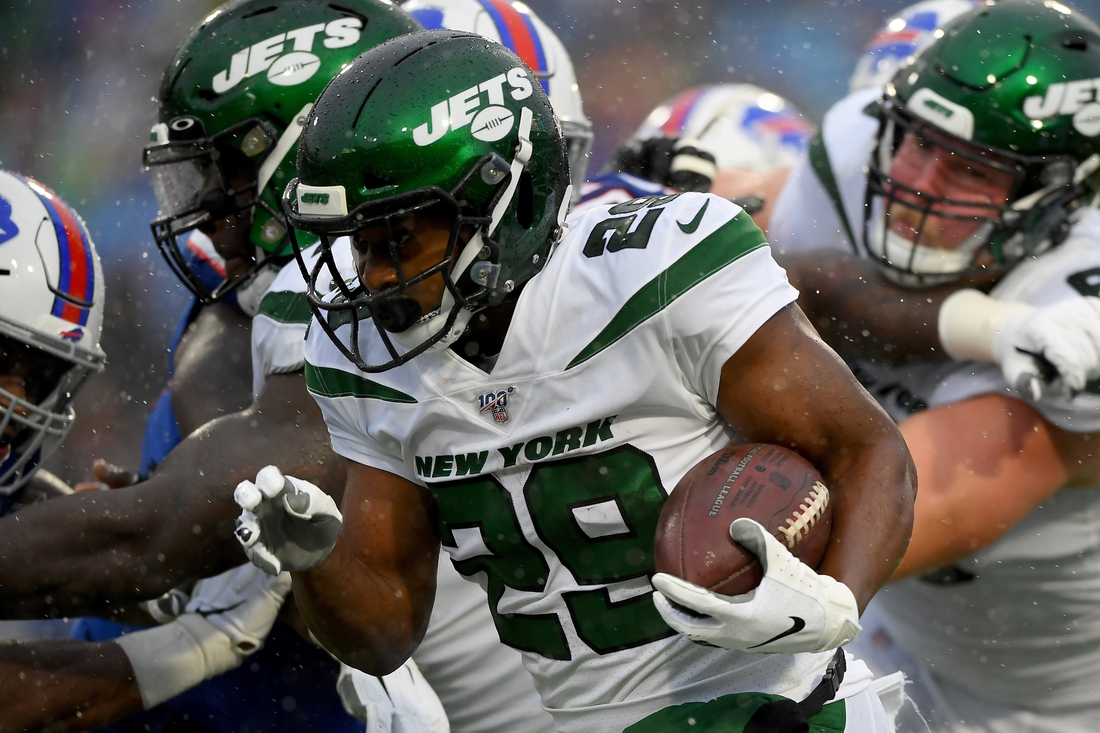 Dec 29, 2019; Orchard Park, New York, USA; New York Jets running back Bilal Powell (29) runs with the ball against the Buffalo Bills during the second quarter at New Era Field. Mandatory Credit: Rich Barnes-USA TODAY Sports