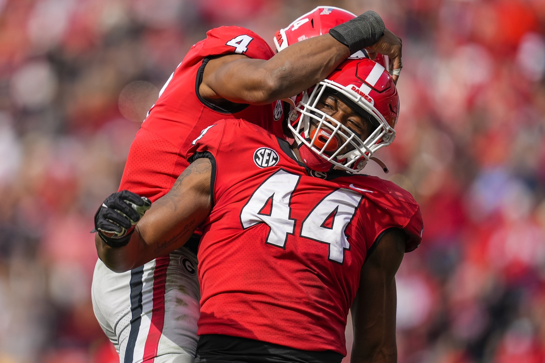 Nov 6, 2021; Athens, Georgia, USA; Georgia Bulldogs defensive lineman Travon Walker (44) reacts with linebacker Nolan Smith (4) after a sack against the Missouri Tigers during the second half at Sanford Stadium. Mandatory Credit: Dale Zanine-USA TODAY Sports