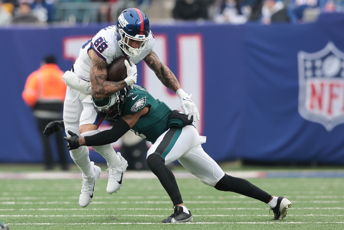 Nov 28, 2021; East Rutherford, New Jersey, USA; New York Giants tight end Evan Engram (88) gains yards after the catch as Philadelphia Eagles cornerback Steven Nelson (3) tackles during the second half at MetLife Stadium. Mandatory Credit: Vincent Carchietta-USA TODAY Sports