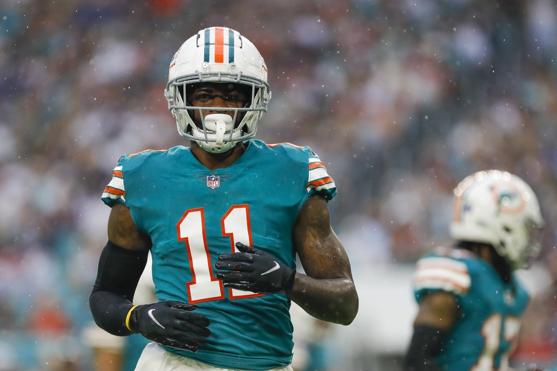Jan 9, 2022; Miami Gardens, Florida, USA; Miami Dolphins wide receiver DeVante Parker (11) watches from the field during the second quarter of the game against the New England Patriots at Hard Rock Stadium. Mandatory Credit: Sam Navarro-USA TODAY Sports