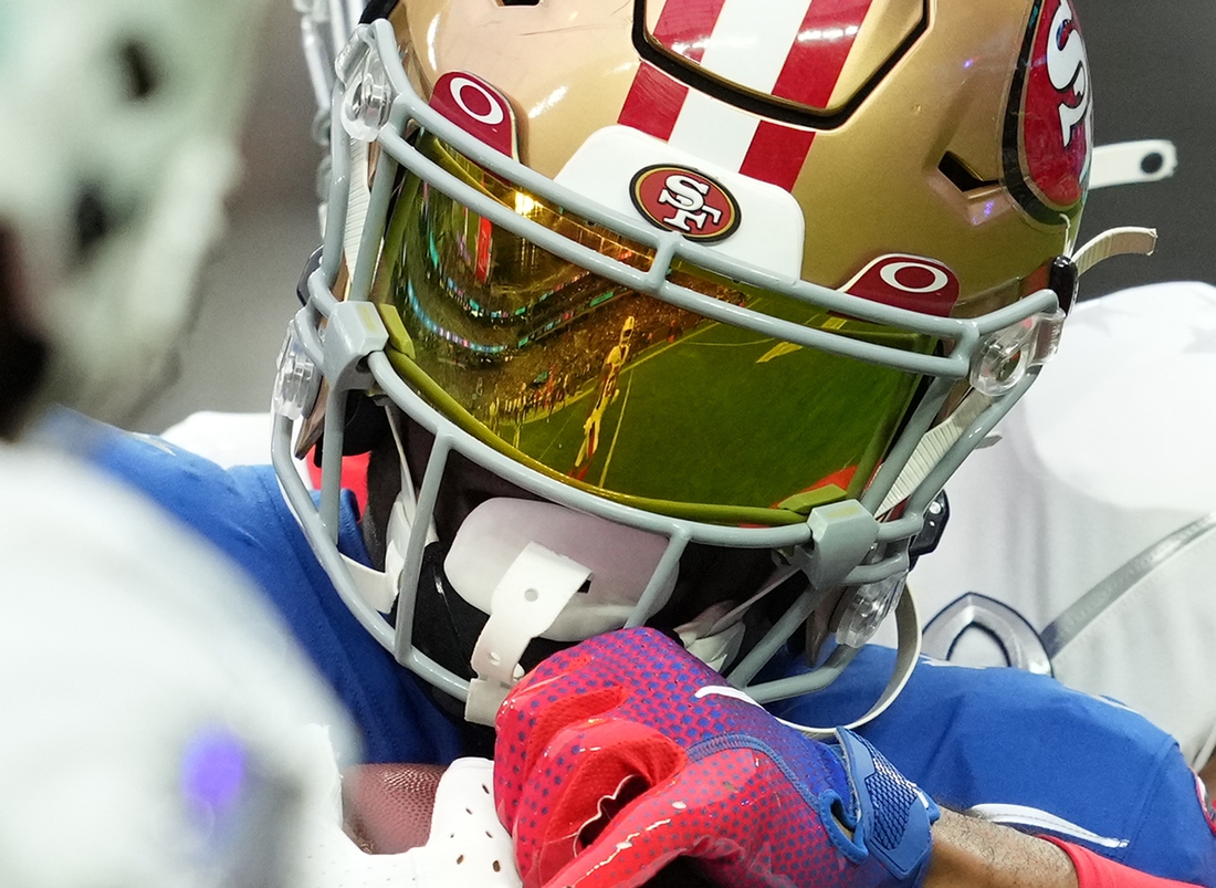 Feb 6, 2022; Paradise, Nevada, USA; Cornerback Xavien Howard of the Miami Dolphins (25) is reflected on the visor of NFC wide receiver Deebo Samuel of the San Francisco 49ers (19) as Samuel is tackled by AFC free safety Kevin Byard of the Tennessee Titans (31) during the Pro Bowl football game at Allegiant Stadium. Mandatory Credit: Stephen R. Sylvanie-USA TODAY Sports
