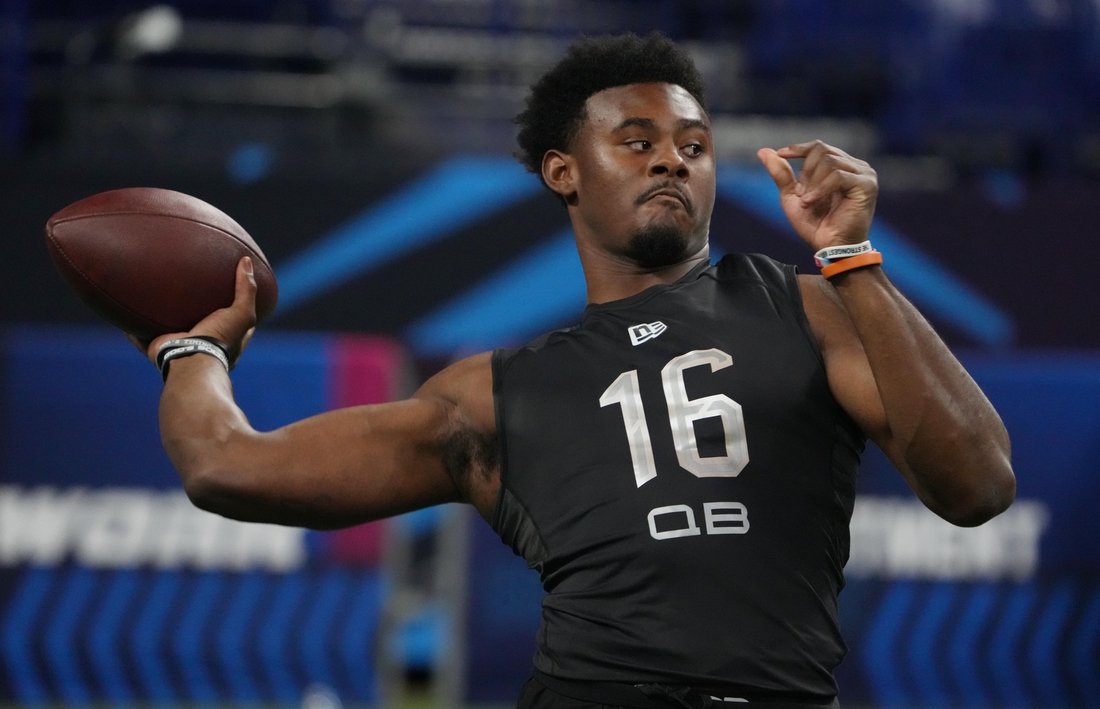 Mar 3, 2022; Indianapolis, IN, USA; Liberty quarterback Malik Willis (QB16) goes through a drill during the 2022 NFL Scouting Combine at Lucas Oil Stadium. Mandatory Credit: Kirby Lee-USA TODAY Sports