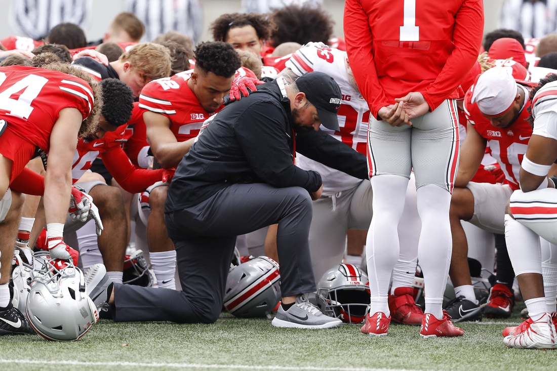 Apr 16, 2022; Columbus, Ohio, USA; Ohio State Buckeyes head coach Ryan Day has a moment of silence for Dwayne Haskins during the Annual Scarlett and Gray Spring game at Ohio Stadium. Mandatory Credit: Joseph Maiorana-USA TODAY Sports