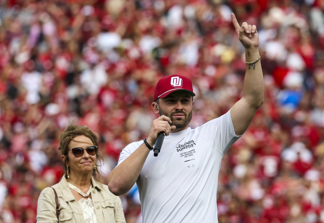 Apr 23, 2022; Norman, Oklahoma, USA;  Oklahoma Sooners former player Baker Mayfield speaks to the crowd as his statue is unveiled during the spring game at Gaylord Family Oklahoma Memorial Stadium. Mandatory Credit: Kevin Jairaj-USA TODAY Sports