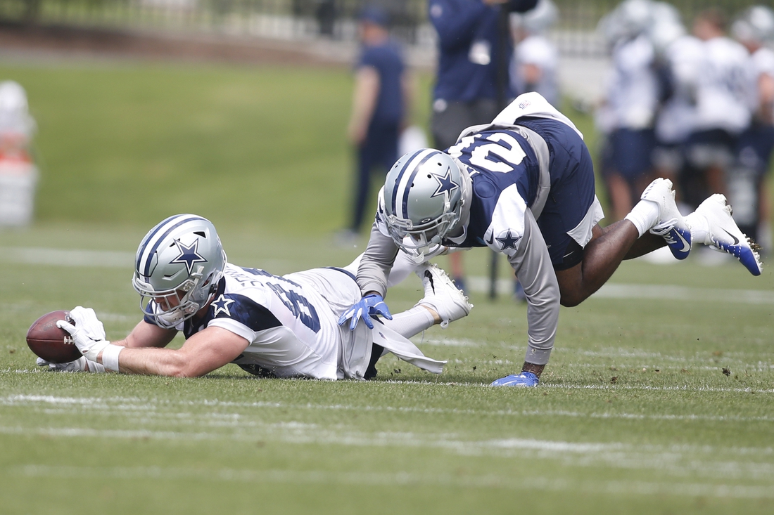 Jun 8, 2021; Frisco, TX, USA; Dallas Cowboys tight end Dalton Schultz (86) catches a pass against cornerback Maurice Canady (28) during voluntary Organized Team Activities at the Ford Center at the Star Training Facility in Frisco, Texas. Mandatory Credit: Tim Heitman-USA TODAY Sports