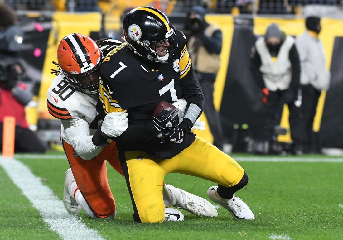 Jan 3, 2022; Pittsburgh, Pennsylvania, USA; Cleveland Browns defensive end Jadeveon Clowney (90) sacks Pittsburgh Steelers quarterback Ben Roethlisberger (7) during the third quarter at Heinz Field. Mandatory Credit: Philip G. Pavely-USA TODAY Sports