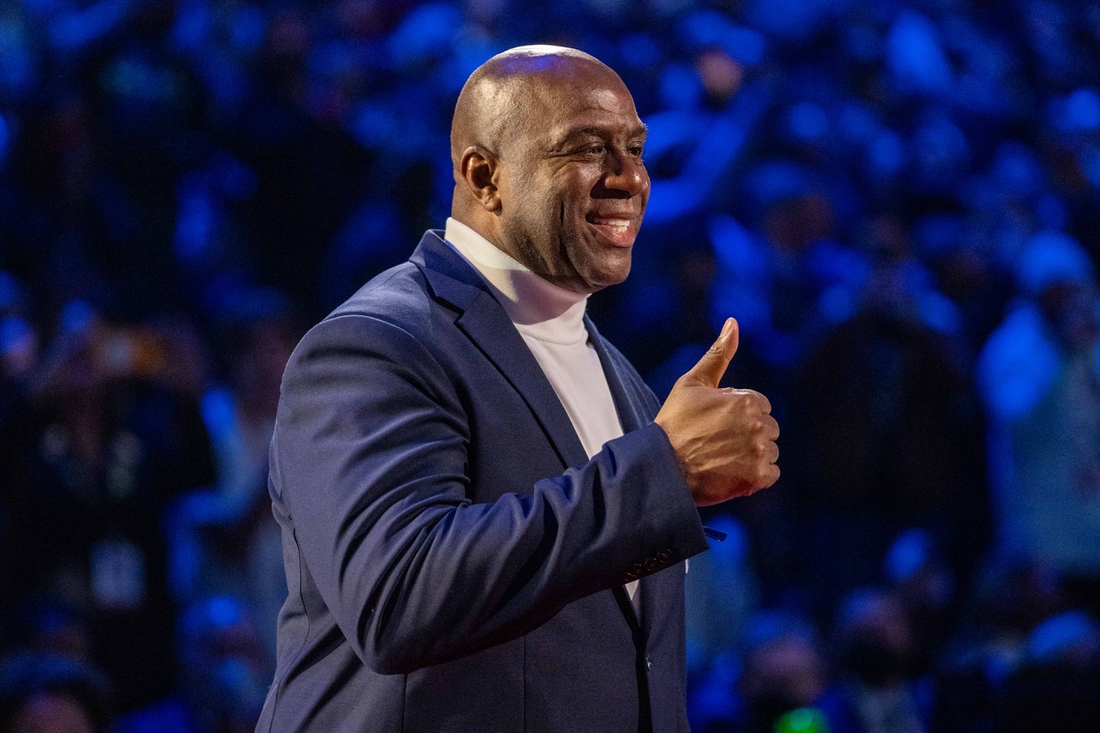 February 20, 2022; Cleveland, Ohio, USA; NBA great Magic Johnson is honored for being selected to the NBA 75th Anniversary Team during halftime in the 2022 NBA All-Star Game at Rocket Mortgage FieldHouse. Mandatory Credit: Kyle Terada-USA TODAY Sports