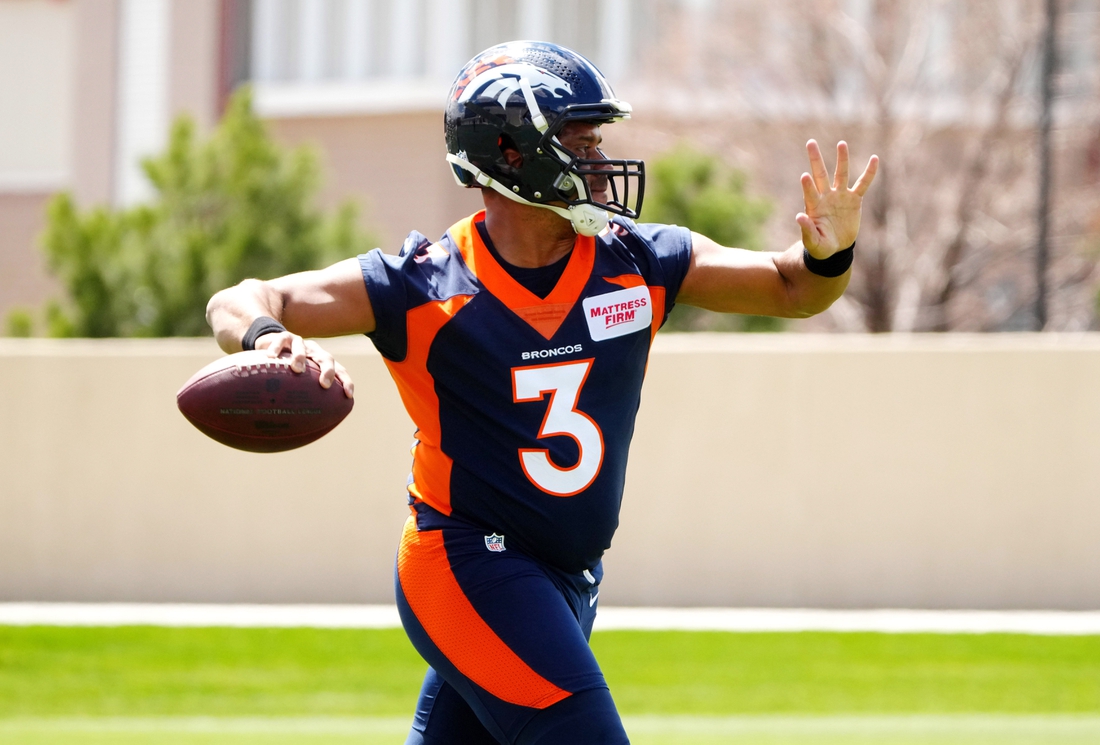 Apr 25, 2022; Englewood, CO, USA; Denver Broncos quarterback Russell Wilson (3) works out during a Denver Broncos mini camp at UCHealth Training Center. Mandatory Credit: Ron Chenoy-USA TODAY Sports