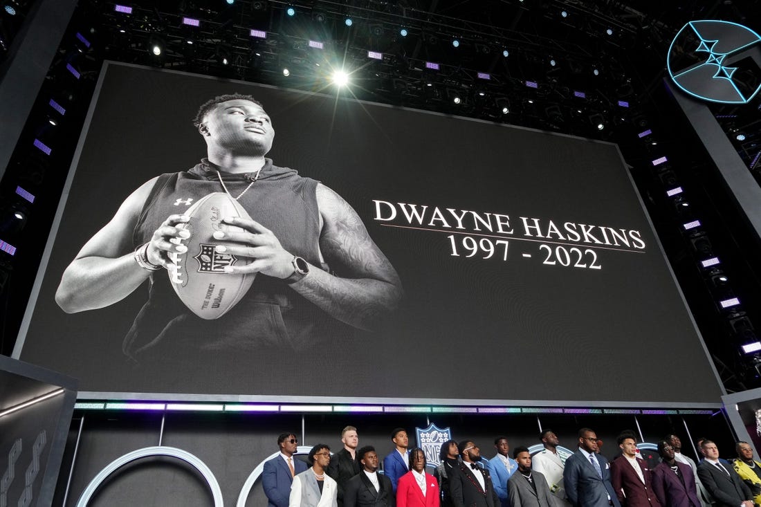 Apr 28, 2022; Las Vegas, NV, USA; A moment of silence is held for Dwayne Haskins before the first round of the 2022 NFL Draft at the NFL Draft Theater. Mandatory Credit: Kirby Lee-USA TODAY Sports