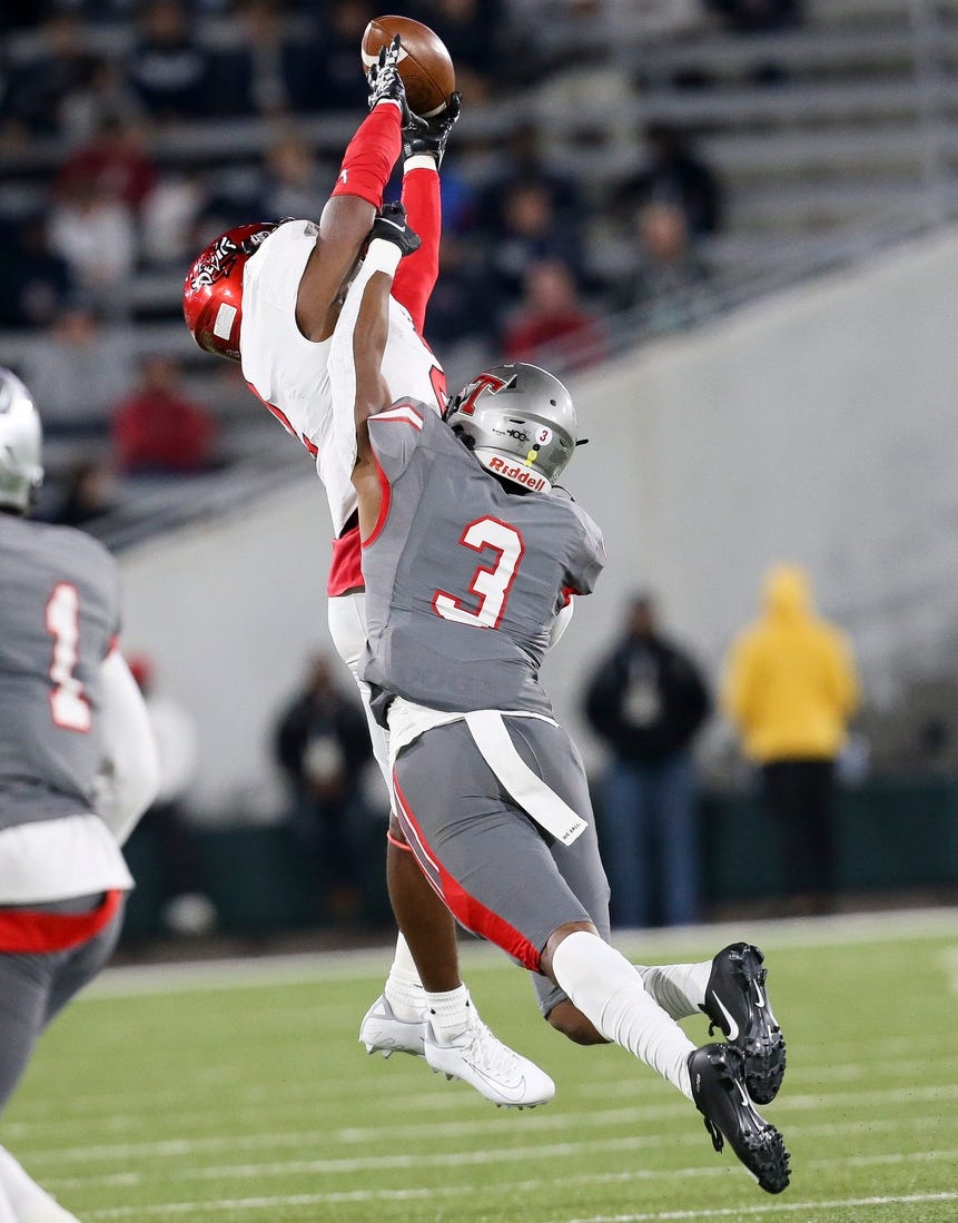 Thompson defensive back Tony Mitchell (3) breaks up a pass intended for Central wide receiver Karmello English (2) during the 7A state championship game in Birmingham Wednesday, Dec. 1, 2021. [Staff Photo/Gary Cosby Jr]

7a Championship Central Vs Thompson