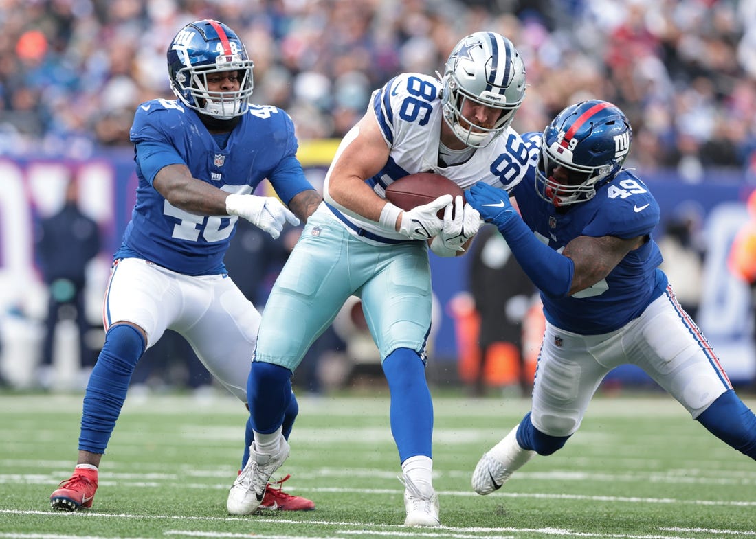 Dec 19, 2021; East Rutherford, New Jersey, USA; Dallas Cowboys tight end Dalton Schultz (86) is tackled by New York Giants inside linebacker Benardrick McKinney (49) and inside linebacker Tae Crowder (48) after a catch during the first half at MetLife Stadium. Mandatory Credit: Vincent Carchietta-USA TODAY Sports