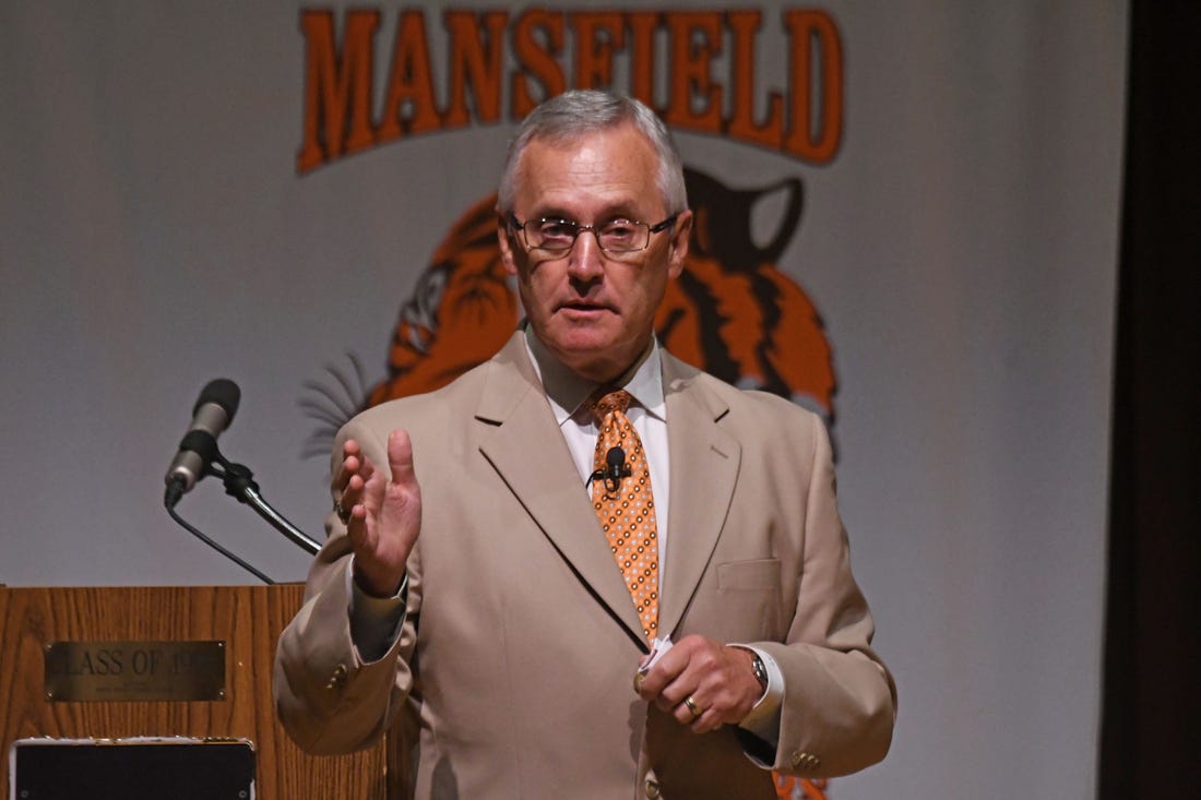 Former Ohio State Football coach and current Youngstown State President Jim Tressel speaks to the Mansfield City Schools employees Tuesday morning.

Jim