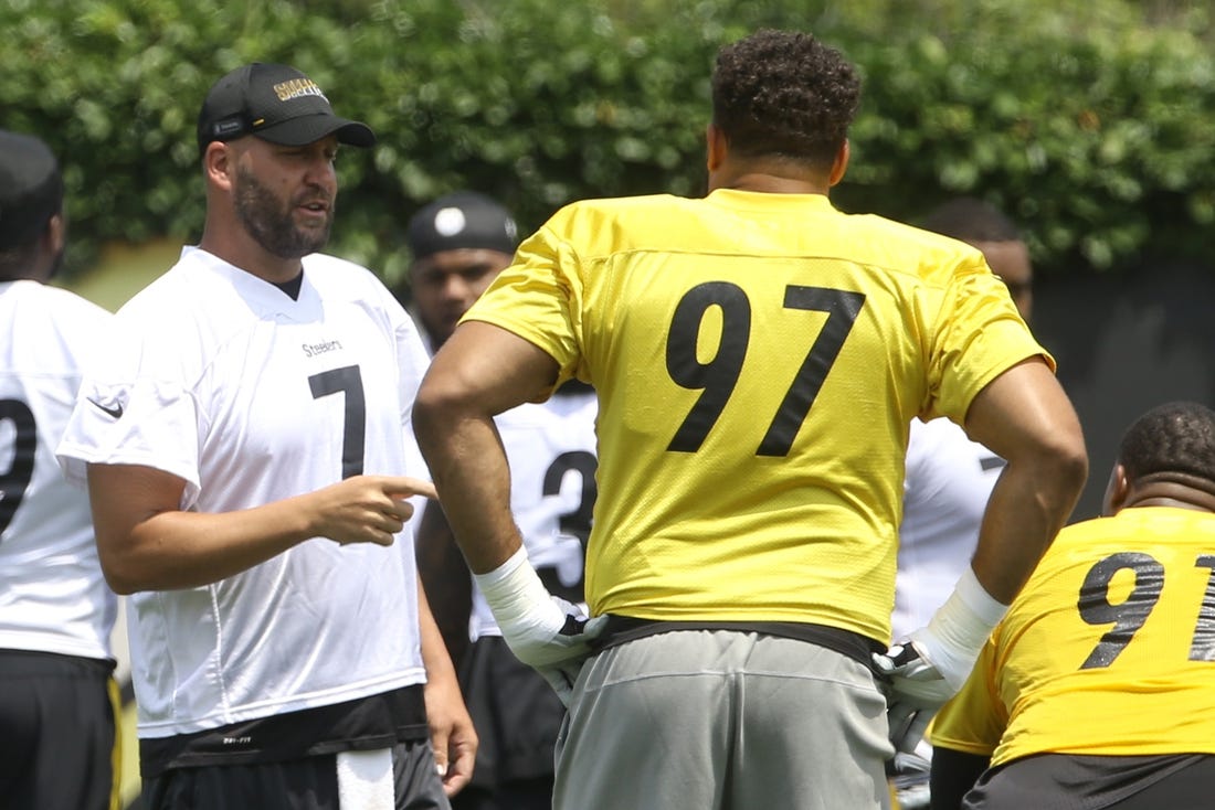 Jul 23, 2021; Pittsburgh, PA, United States;  Pittsburgh Steelers quarterback Ben Roethlisberger (7) talks with defensive tackle Cameron Heyward (97) before drills during training camp at the Rooney UPMC Sports Performance Complex. Mandatory Credit: Charles LeClaire-USA TODAY Sports
