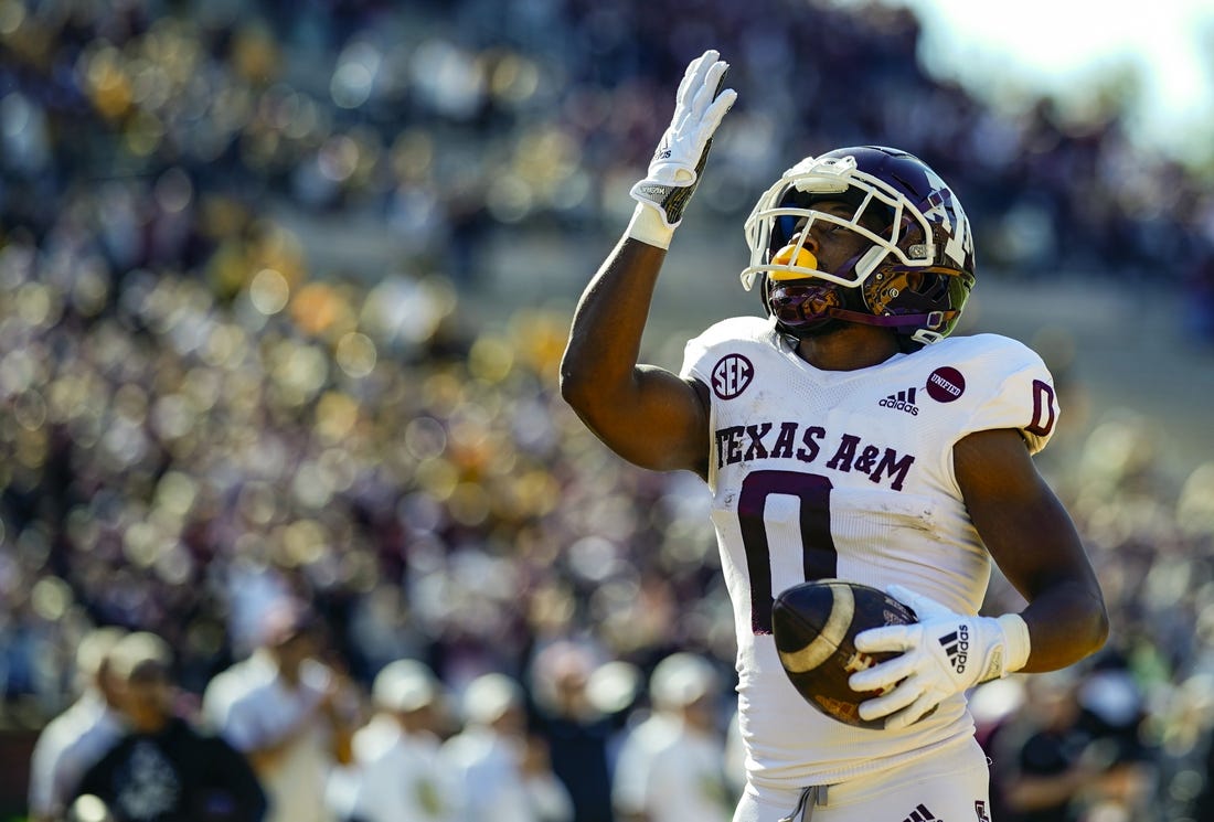 Oct 16, 2021; Columbia, Missouri, USA; Texas A&M Aggies wide receiver Ainias Smith (0) celebrates after scoring a touchdown against the Missouri Tigers during the first half at Faurot Field at Memorial Stadium. Mandatory Credit: Jay Biggerstaff-USA TODAY Sports