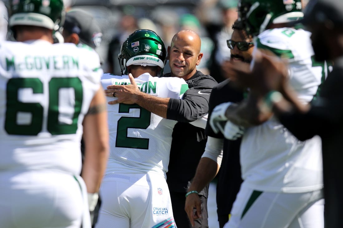 Oct 3, 2021; East Rutherford, NJ, USA;  New York Jets head coach Robert Saleh hugs quarterback Zach Wilson before the game against the Tennessee Titans at MetLife Stadium. Mandatory Credit: Kevin R. Wexler-USA TODAY Sports