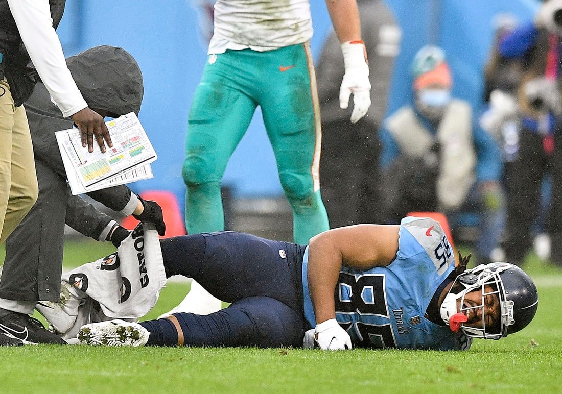 Tennessee Titans tight end MyCole Pruitt (85) lies on the field after he was injured during the second quarter at Nissan Stadium Sunday, Jan. 2, 2022 in Nashville, Tenn.

Titans Dolphins 097