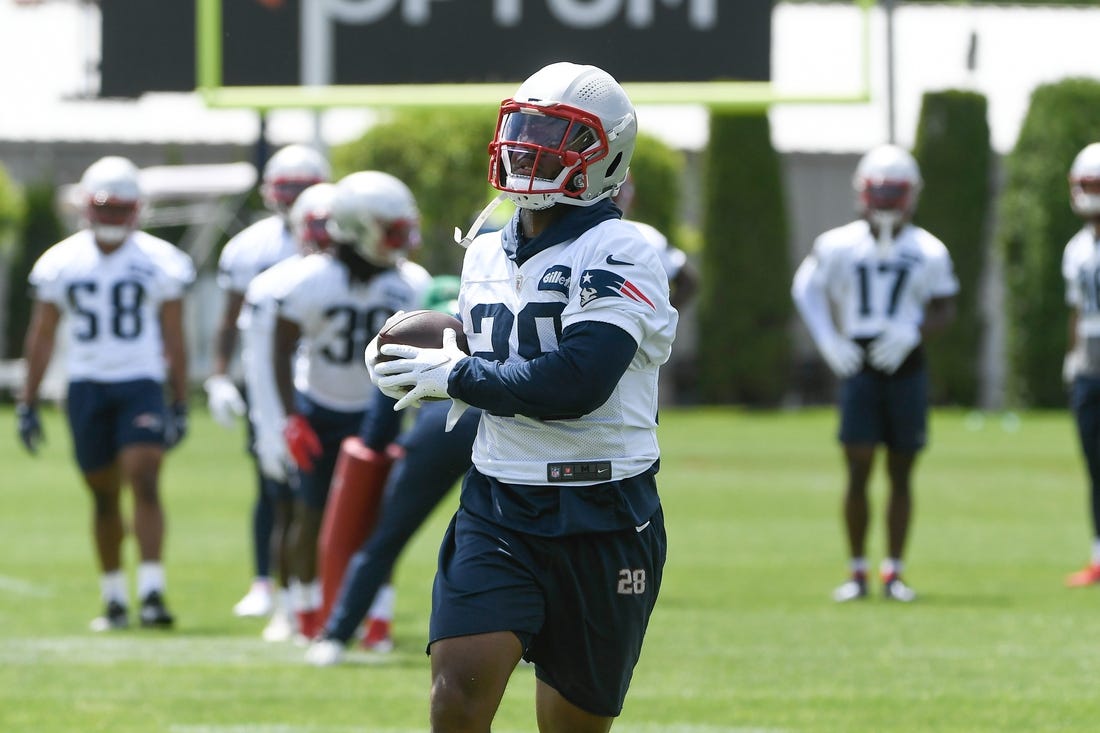 May 23, 2022; Foxborough, MA, USA; New England Patriots running back James White (28) catches the ball at the team's OTA at Gillette Stadium. Mandatory Credit: Eric Canha-USA TODAY Sports