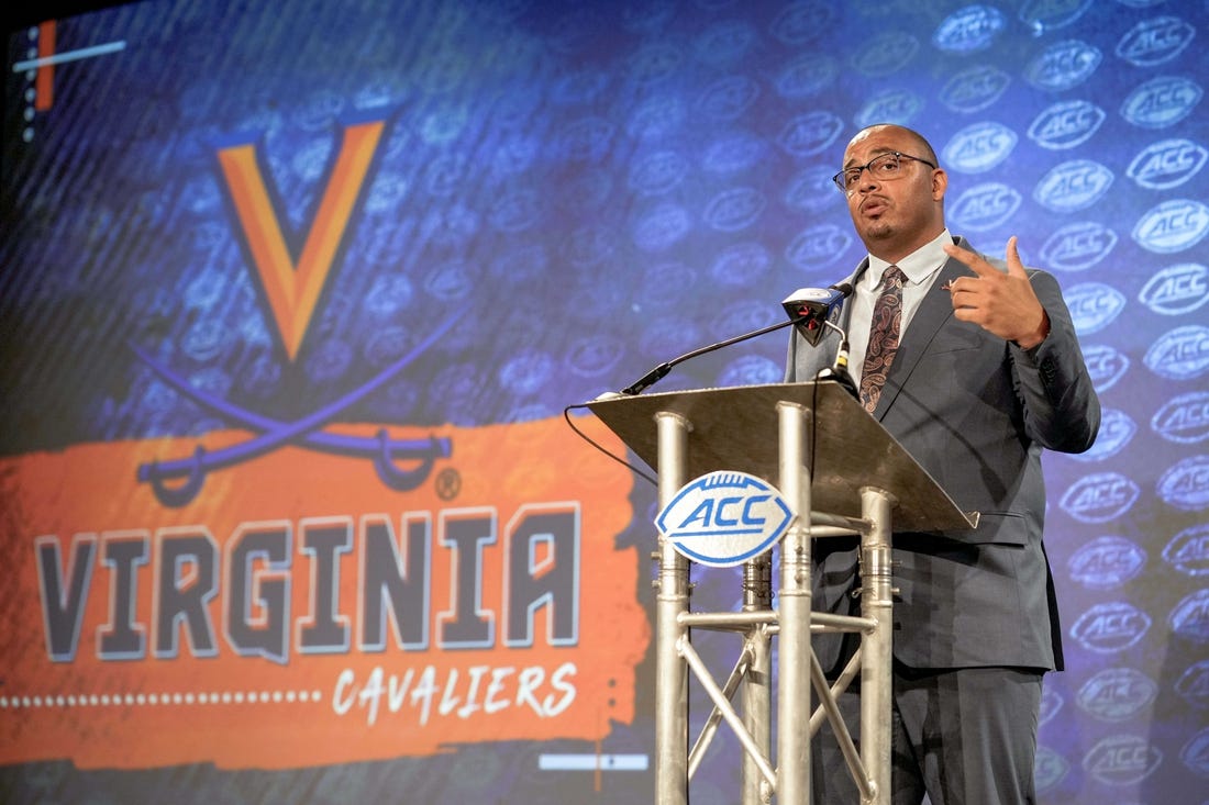 Jul 21, 2022; Charlotte, NC, USA;  Virginia Head Coach Tony Elliott talks to the media during the second day of ACC Media Days at the Westin Hotel in Charlotte, NC. Mandatory Credit: Jim Dedmon-USA TODAY Sports