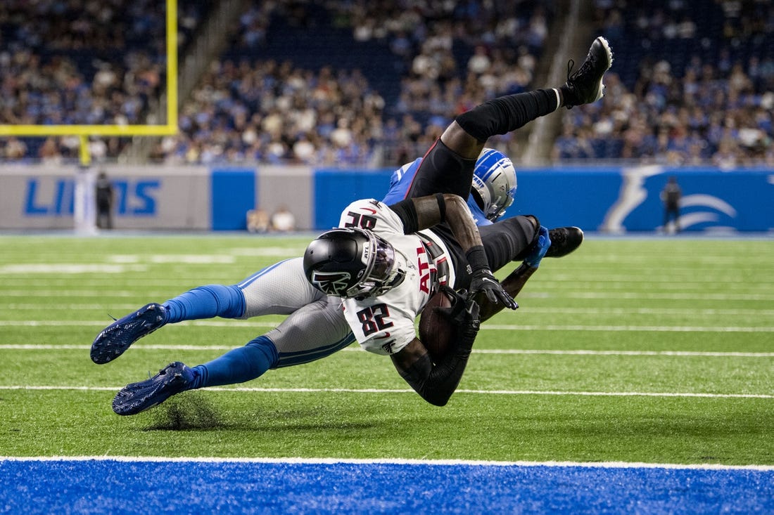 Aug 12, 2022; Detroit, Michigan, USA; Atlanta Falcons wide receiver Geronimo Allison (82) is upended by Detroit Lions safety Kerby Joseph (31) at the one yard line after catching a pass from quarterback Desmond Ridder (not pictured) in the second quarter at Ford Field. Mandatory Credit: Lon Horwedel-USA TODAY Sports