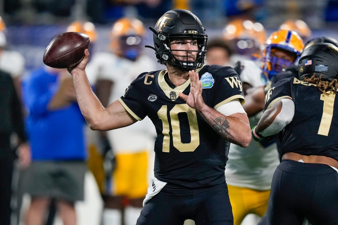 Dec 4, 2021; Charlotte, NC, USA; Wake Forest Demon Deacons quarterback Sam Hartman (10) during the first quarter in the ACC championship game at Bank of America Stadium. Mandatory Credit: Jim Dedmon-USA TODAY Sports