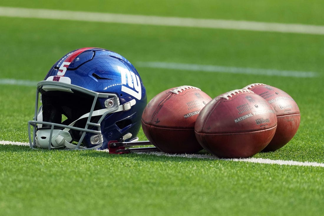 Dec 12, 2021; Inglewood, California, USA; A detailed view of  a New York Giants helmet and Wilson official NFL Due footballs at SoFi Stadium. Mandatory Credit: Kirby Lee-USA TODAY Sports