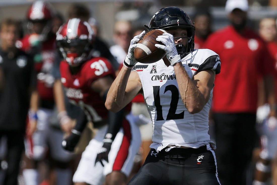 Cincinnati Bearcats wide receiver Alec Pierce (12) catches a short pass in the second quarter of the NCAA football game between the Indiana Hoosiers and the Cincinnati Bearcats at Memorial Stadium in Bloomington, Ind., on Saturday, Sept. 18, 2021.

Syndication The Enquirer