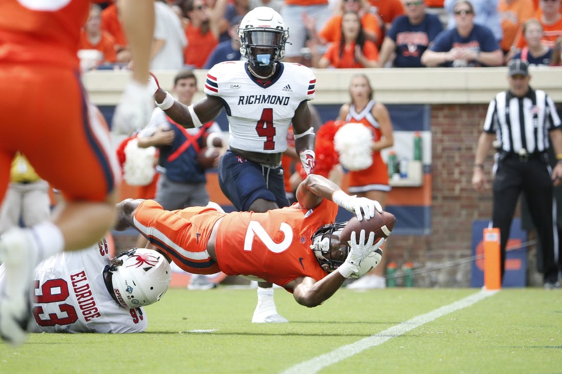 Sep 3, 2022; Charlottesville, Virginia, USA; Virginia Cavaliers running back Perris Jones (2) scores a touchdown in front of Richmond Spiders defensive lineman Ray Eldridge (93) during the first half at Scott Stadium. Mandatory Credit: Amber Searls-USA TODAY Sports
