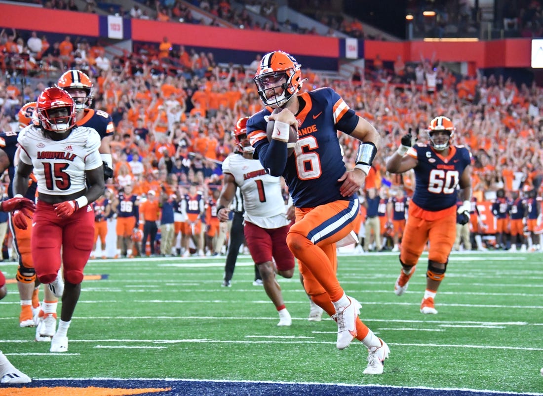 Sep 3, 2022; Syracuse, New York, USA; Syracuse Orange quarterback Garrett Shrader (6) runs for a touchdown against the Louisville Cardinals in the fourth quarter at JMA Wireless Dome. Mandatory Credit: Mark Konezny-USA TODAY Sports