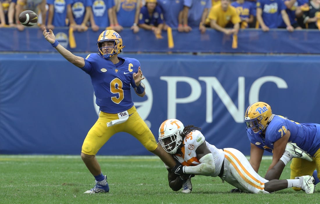Sep 10, 2022; Pittsburgh, Pennsylvania, USA;  Pittsburgh Panthers quarterback Kedon Slovis (9) passes under pressure from Tennessee Volunteers defensive lineman Roman Harrison (30) during the second quarter at Acrisure Stadium. Mandatory Credit: Charles LeClaire-USA TODAY Sports