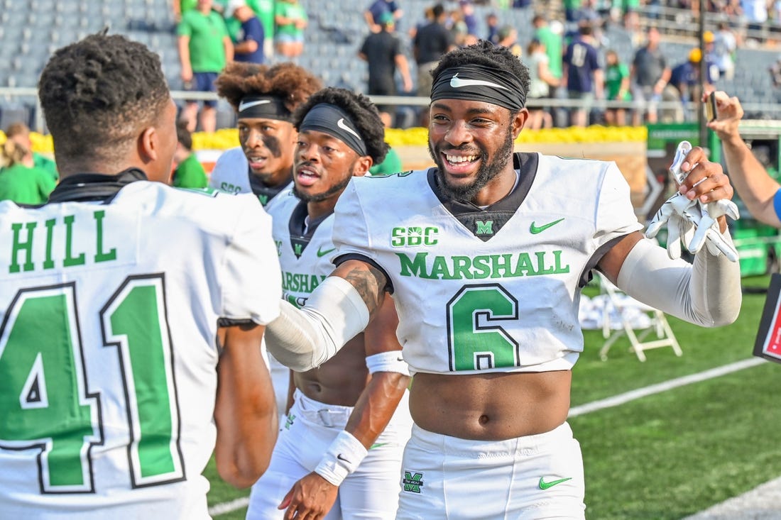 Sep 10, 2022; South Bend, Indiana, USA; Marshall Thundering Herd defensive back Micah Abraham (6) celebrates as he leaves the field after the Thundering Herd beat the Notre Dame Fighting Irish 26-21 at Notre Dame Stadium. Mandatory Credit: Matt Cashore-USA TODAY Sports