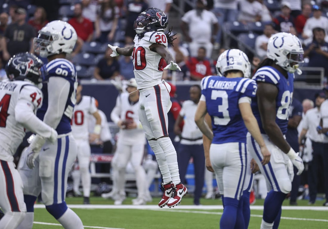 Sep 11, 2022; Houston, Texas, USA; Houston Texans cornerback Isaac Yiadom (20) leaps after Indianapolis Colts place kicker Rodrigo Blankenship (3) misses a field goal attempt during overtime at NRG Stadium. Mandatory Credit: Troy Taormina-USA TODAY Sports