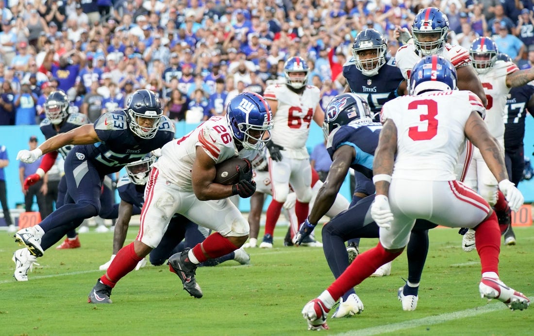 New York Giants running back Saquon Barkley (26) runs for a two-point conversion during the fourth quarter at Nissan Stadium Sunday, Sept. 11, 2022, in Nashville, Tenn.

Nfl New York Giants At Tennessee Titans