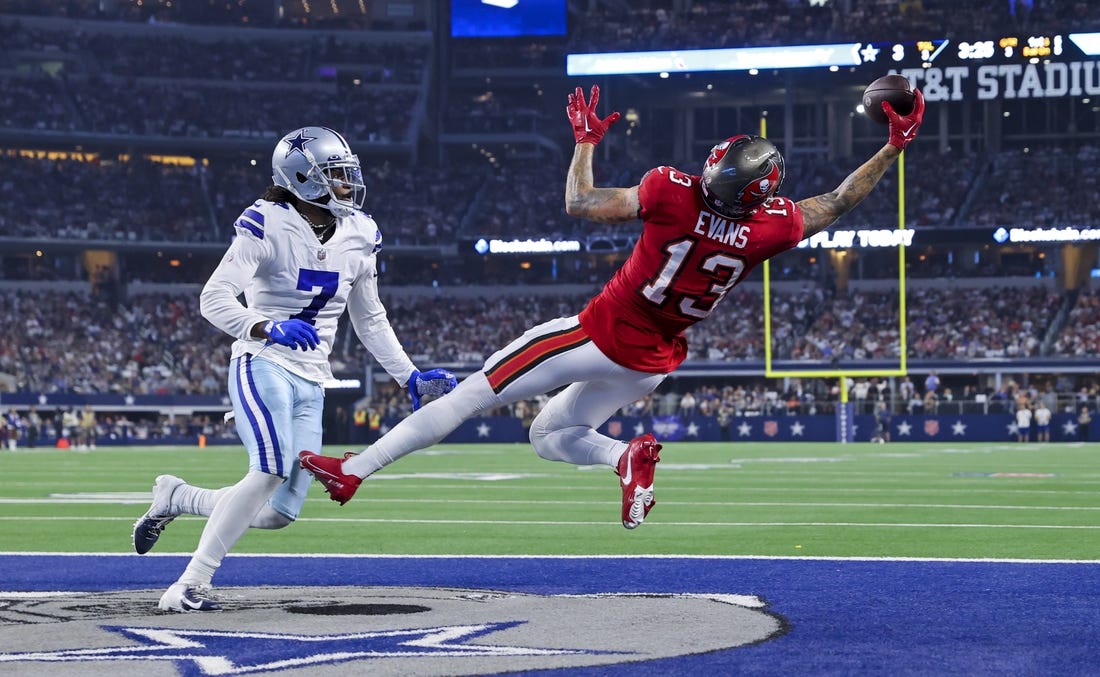 Sep 11, 2022; Arlington, Texas, USA;  Tampa Bay Buccaneers wide receiver Mike Evans (13) makes a leaping touchdown catch over Dallas Cowboys cornerback Trevon Diggs (7) during the third quarter at AT&T Stadium. Mandatory Credit: Kevin Jairaj-USA TODAY Sports