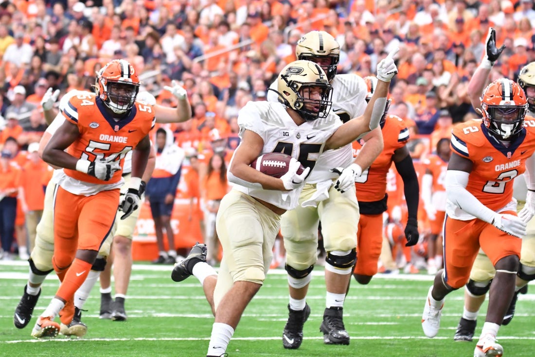 Sep 17, 2022; Syracuse, New York, USA; Purdue Boilermakers running back Devin Mockobee (45) runs for a touchdown against the Syracuse Orange in the first quarter at JMA Wireless Dome. Mandatory Credit: Mark Konezny-USA TODAY Sports