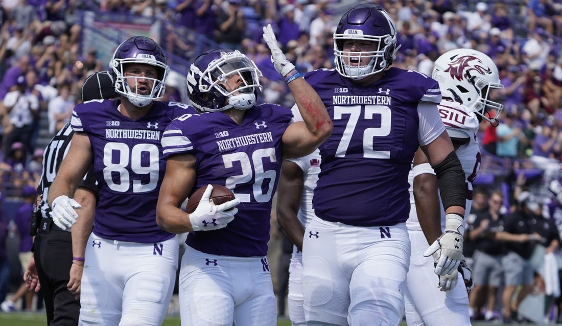 Sep 17, 2022; Evanston, Illinois, USA; Northwestern Wildcats running back Evan Hull (26) celebrates after scoring a touchdown against the Southern Illinois Salukis during the first half at Ryan Field. Mandatory Credit: David Banks-USA TODAY Sports