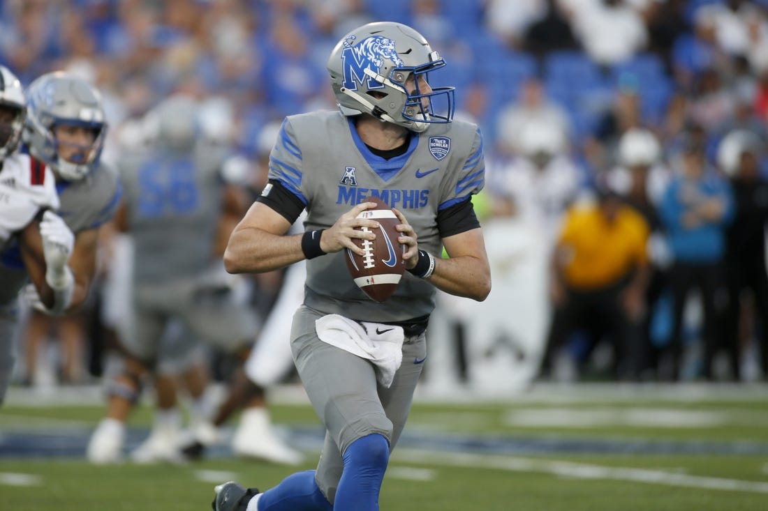 Sep 17, 2022; Memphis, Tennessee, USA; Memphis Tigers quarterback Seth Henigan (5) scrambles during the first half against the Arkansas State Red Wolves at Liberty Bowl Memorial Stadium. Mandatory Credit: Petre Thomas-USA TODAY Sports