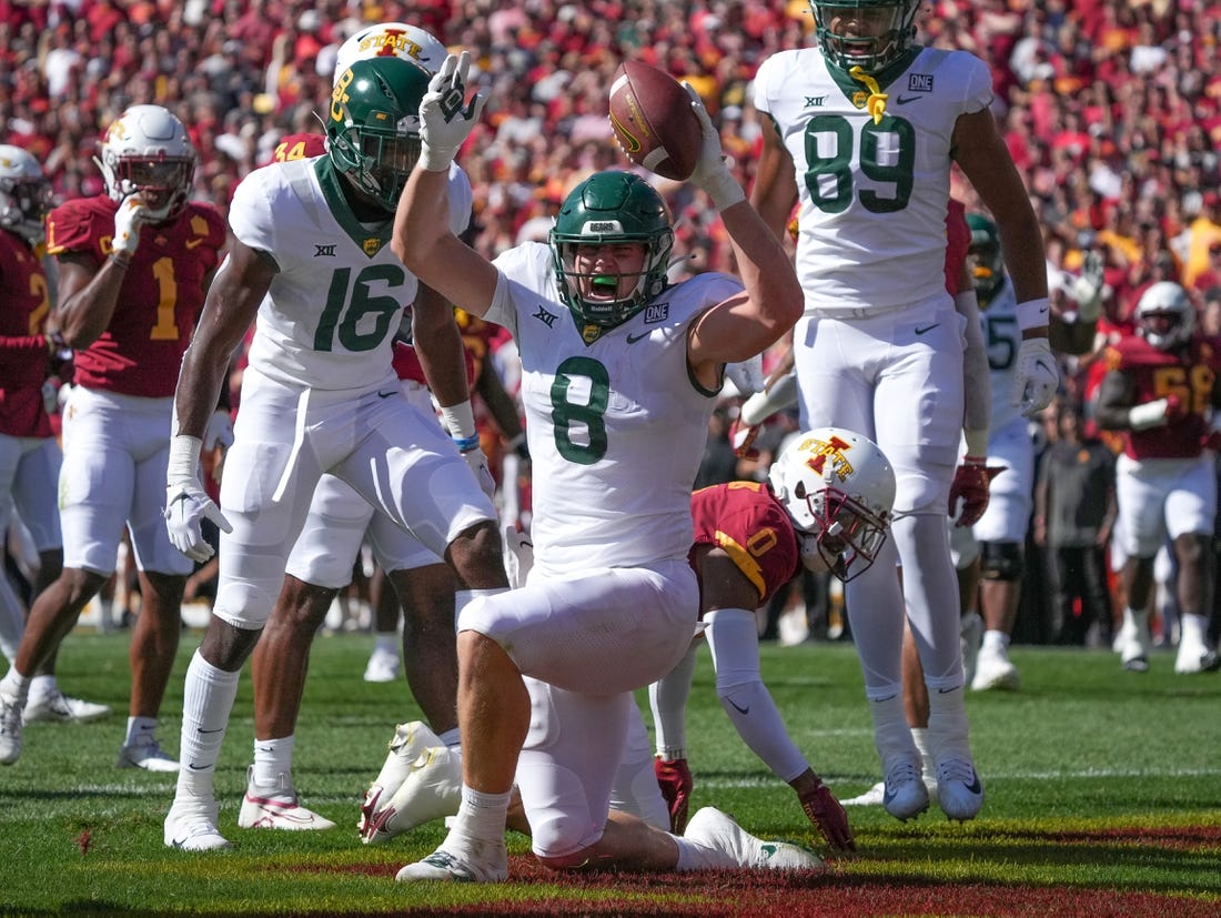 Sep 24, 2022; Ames, Iowa, USA; Baylor tight end Ben Sims (8) scores a touchdown in the first quarter against Iowa State at Jack Trice Stadium. Mandatory Credit: Bryon Houlgrave/Des Moines Register-USA TODAY Sports