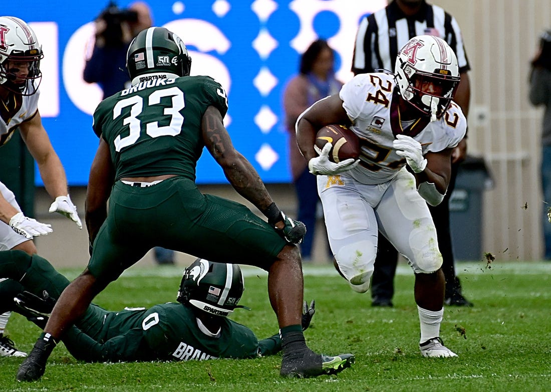 Sep 24, 2022; East Lansing, Michigan, USA;  Minnesota Golden Gophers running back Mohamed Ibrahim (24) runs for a first down in the second quarter against the Michigan State Spartans at Spartan Stadium. Mandatory Credit: Dale Young-USA TODAY Sports