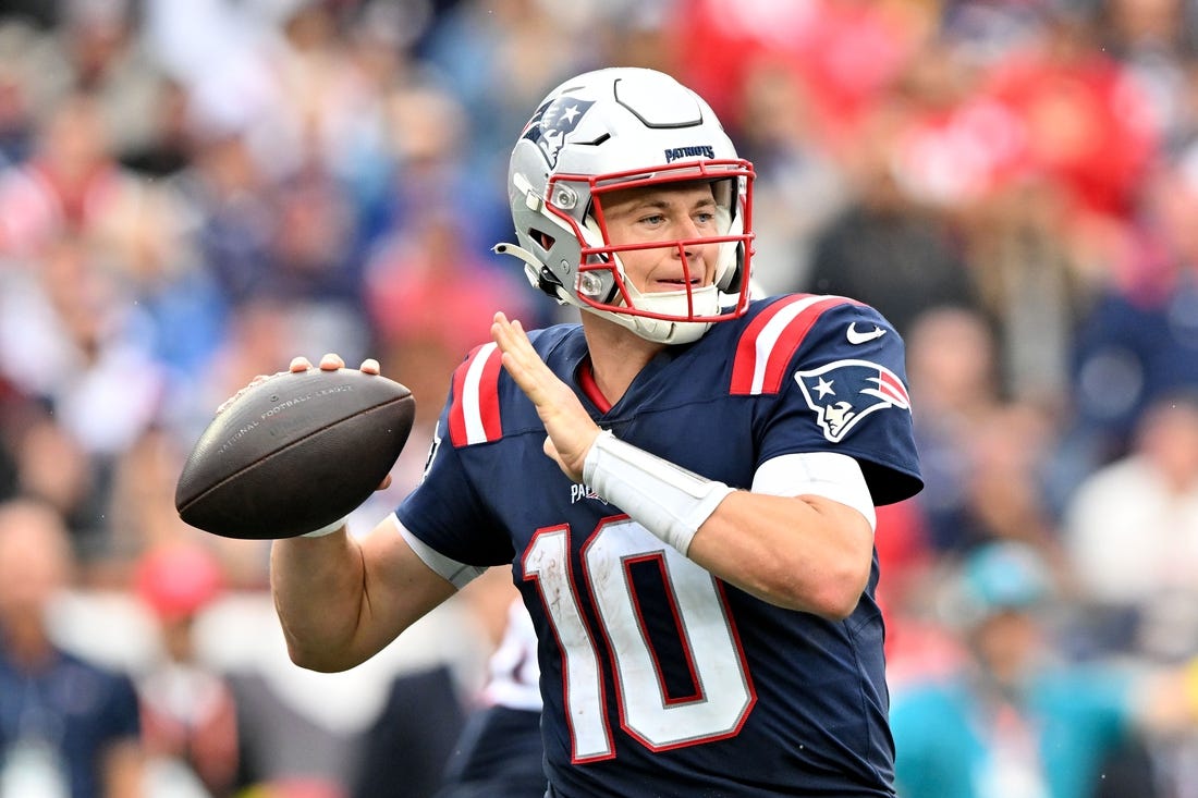 Sep 25, 2022; Foxborough, Massachusetts, USA; New England Patriots quarterback Mac Jones (10) throws the ball against the Baltimore Ravens during the second half at Gillette Stadium. Mandatory Credit: Brian Fluharty-USA TODAY Sports