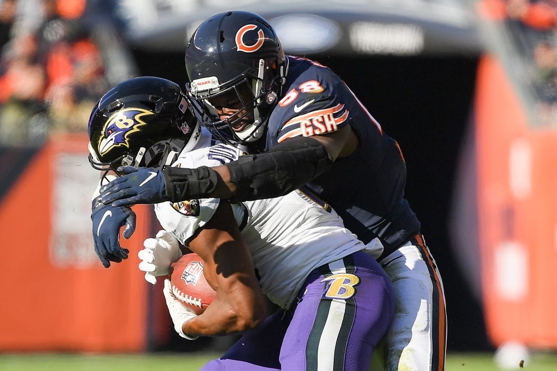 Nov 21, 2021; Chicago, Illinois, USA; Chicago Bears inside linebacker Roquan Smith (58) tackles Baltimore Ravens wide receiver Devin Duvernay (13) in the first half at Soldier Field. Mandatory Credit: Quinn Harris-USA TODAY Sports
