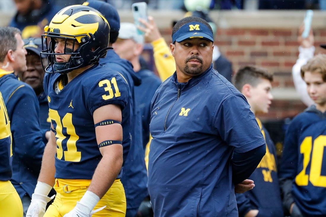 Michigan running back coach Mike Hart watches warm ups ahead of the Maryland game at Michigan Stadium in Ann Arbor on Saturday, Sept. 24, 2022.