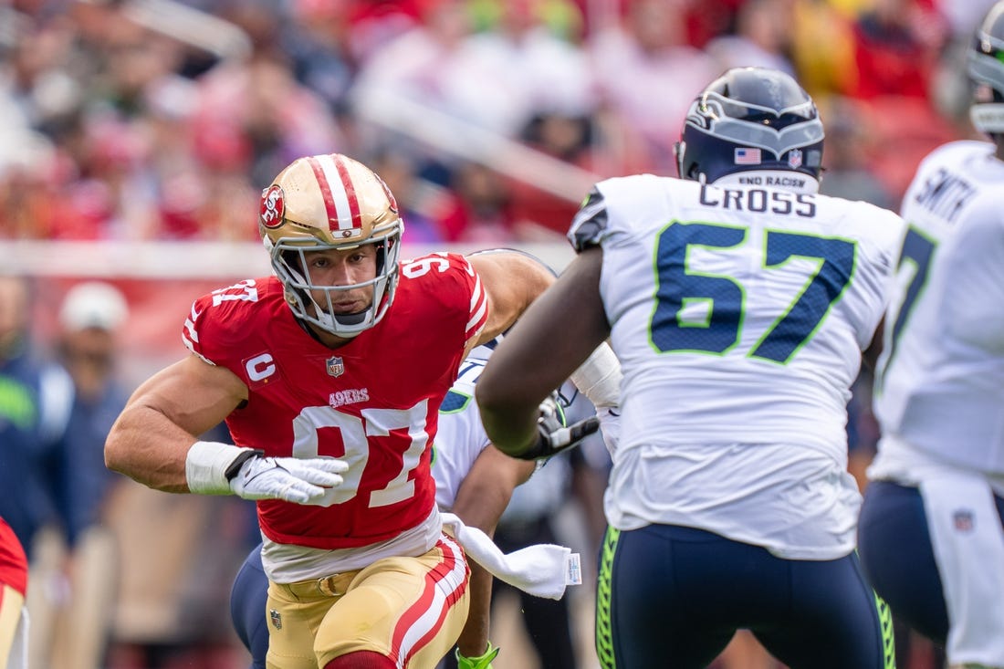 September 18, 2022; Santa Clara, California, USA; San Francisco 49ers defensive end Nick Bosa (97) rushes against Seattle Seahawks offensive tackle Charles Cross (67) during the first quarter at Levi's Stadium. Mandatory Credit: Kyle Terada-USA TODAY Sports