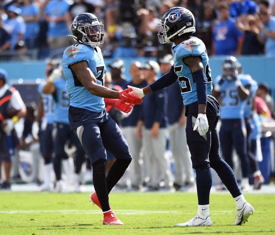 Sep 25, 2022; Nashville, Tennessee, USA; Tennessee Titans safety Kevin Byard (31) and cornerback Kristian Fulton (26) celebrate after a defensive stop during the second half against the Las Vegas Raiders at Nissan Stadium. Mandatory Credit: Christopher Hanewinckel-USA TODAY Sports