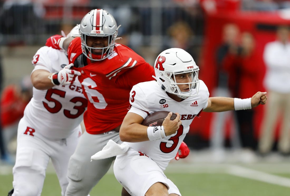 Oct 1, 2022; Columbus, Ohio, USA;  Rutgers Scarlet Knights quarterback Evan Simon (3) runs with the ball as Ohio State Buckeyes defensive tackle Taron Vincent (6) closes in for the tackle during the second quarter at Ohio Stadium. Mandatory Credit: Joseph Maiorana-USA TODAY Sports