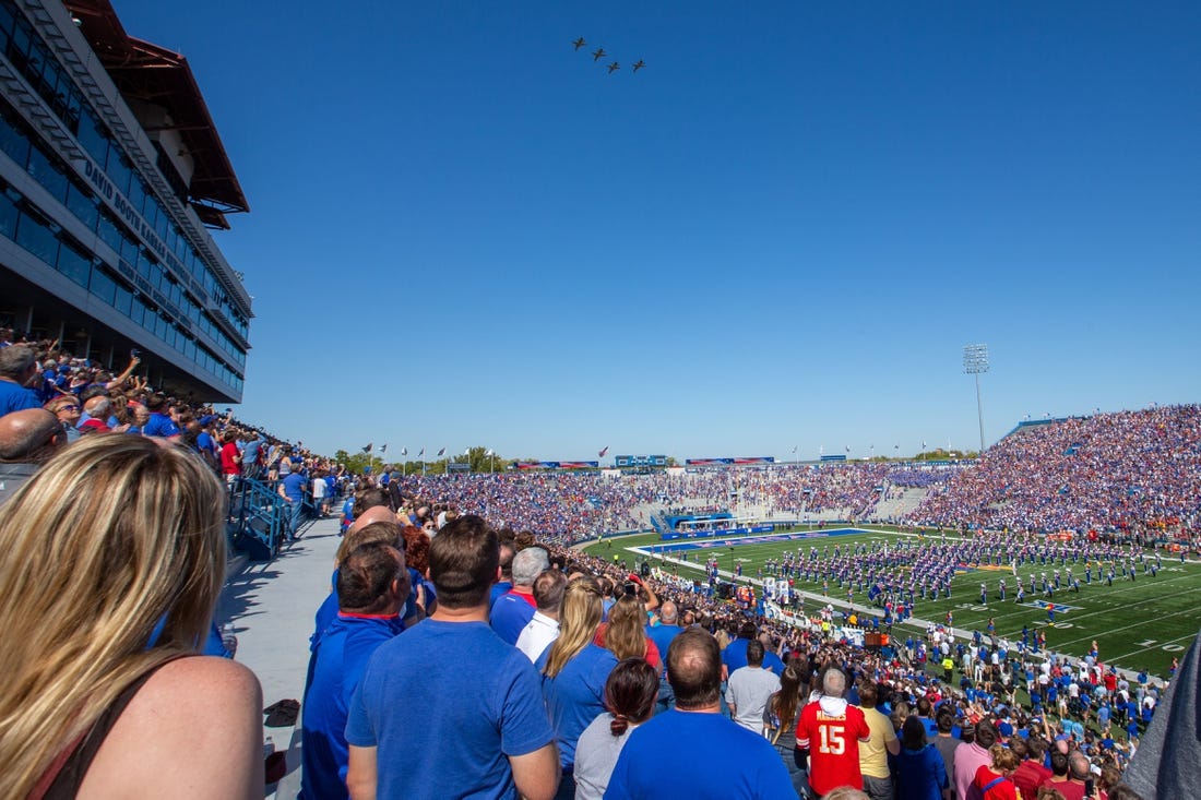 A formation of F-16 fighter jets fly over David Booth Kansas Memorial Stadium before the start of Saturday's game against Iowa State.