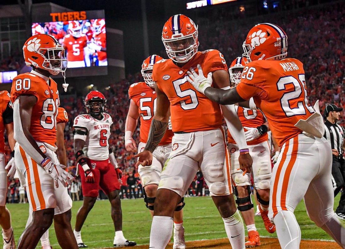 Oct 1, 2022; Clemson, South Carolina, USA;   Clemson quarterback D.J. Uiagalelei (5) celebrates a score with running back Phil Mafah (26) against  NC State on a one-yard touchdown run during the second quarter at Memorial Stadium. Mandatory Credit: Ken Ruinard-USA TODAY Sports