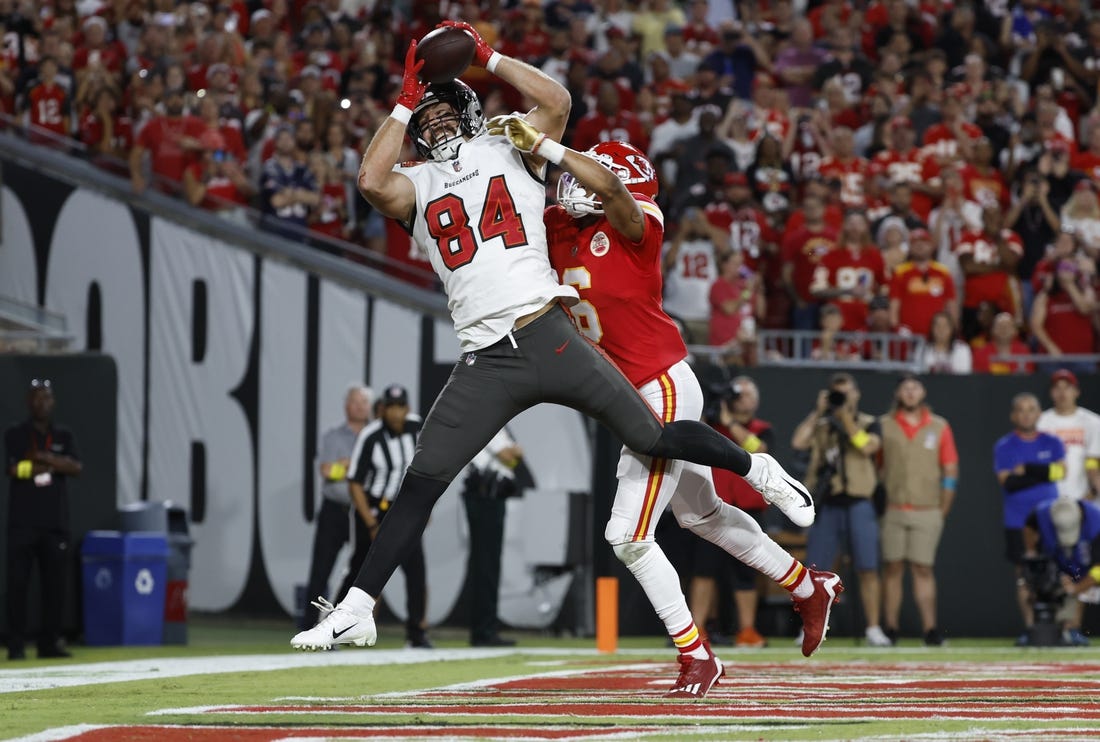 Oct 2, 2022; Tampa, Florida, USA;Kansas City Chiefs safety Bryan Cook (6) breaks up Tampa Bay Buccaneers tight end Cameron Brate (84) catch during the first half at Raymond James Stadium. Mandatory Credit: Kim Klement-USA TODAY Sports