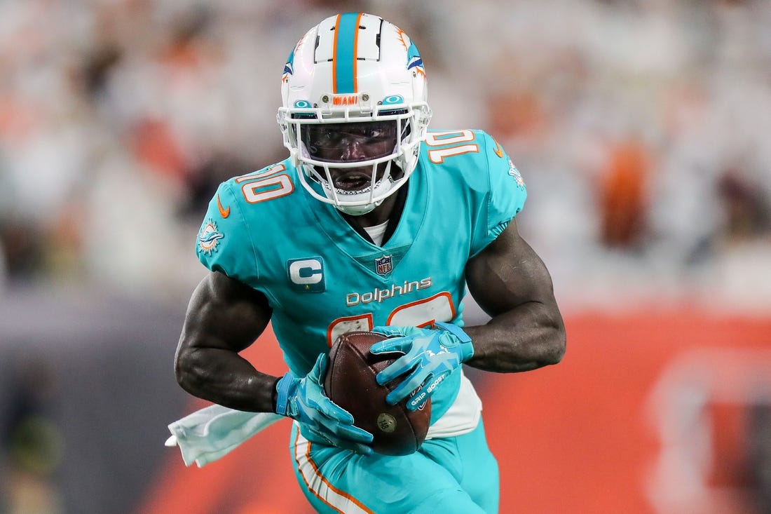 Sep 29, 2022; Cincinnati, Ohio, USA; Miami Dolphins wide receiver Tyreek Hill (10) runs with the ball against the Cincinnati Bengals in the first half at Paycor Stadium. Mandatory Credit: Katie Stratman-USA TODAY Sports
