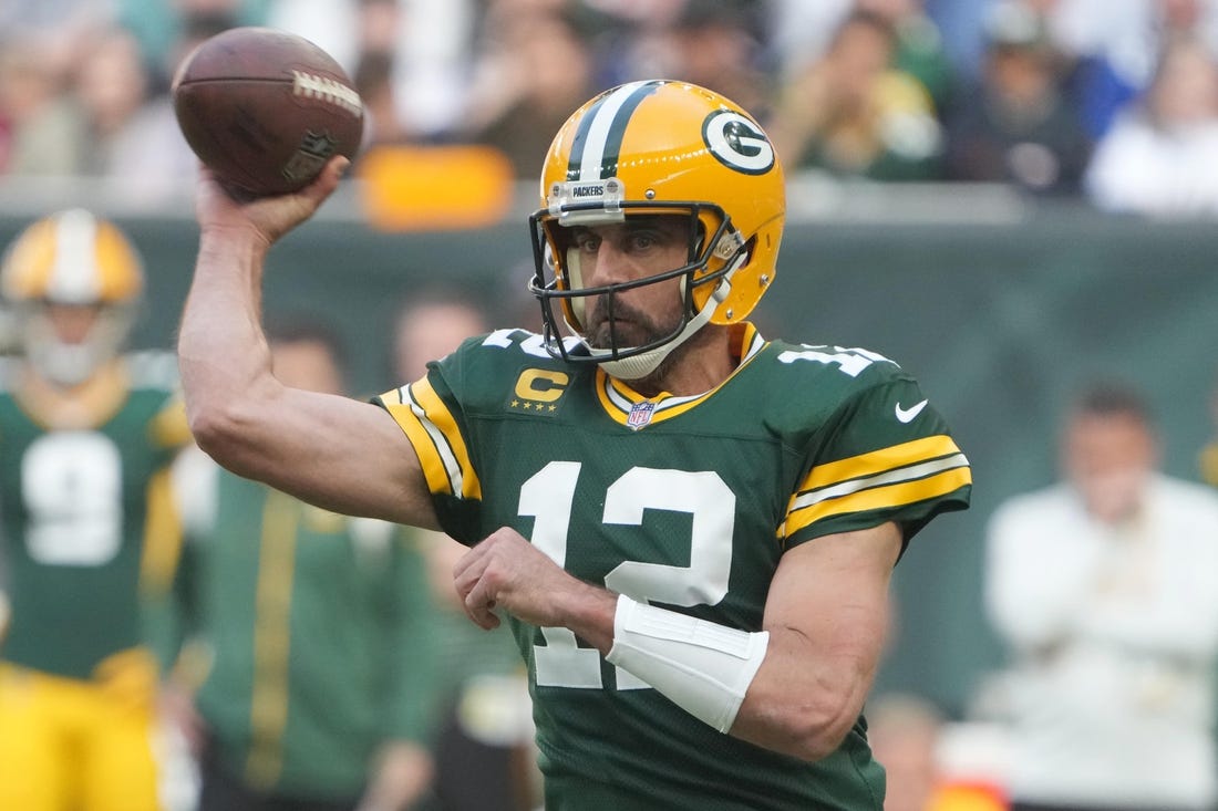 Oct 9, 2022; London, United Kingdom; Green Bay Packers quarterback Aaron Rodgers (12) throws the ball in the first quarter against the New York Giants during an NFL International Series game at Tottenham Hotspur Stadium. Mandatory Credit: Kirby Lee-USA TODAY Sports